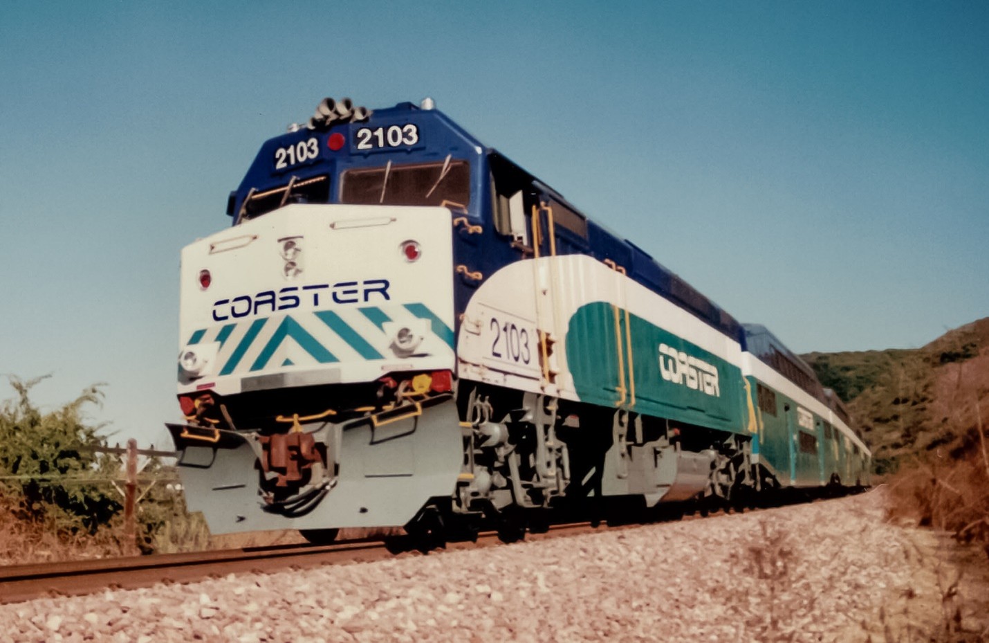 SDNX 2103 shoves an eastbound train up the Miramar Grade in 1995. Photo by Randy Houk.